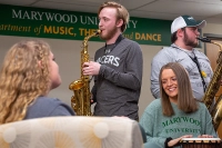 students playing different instruments